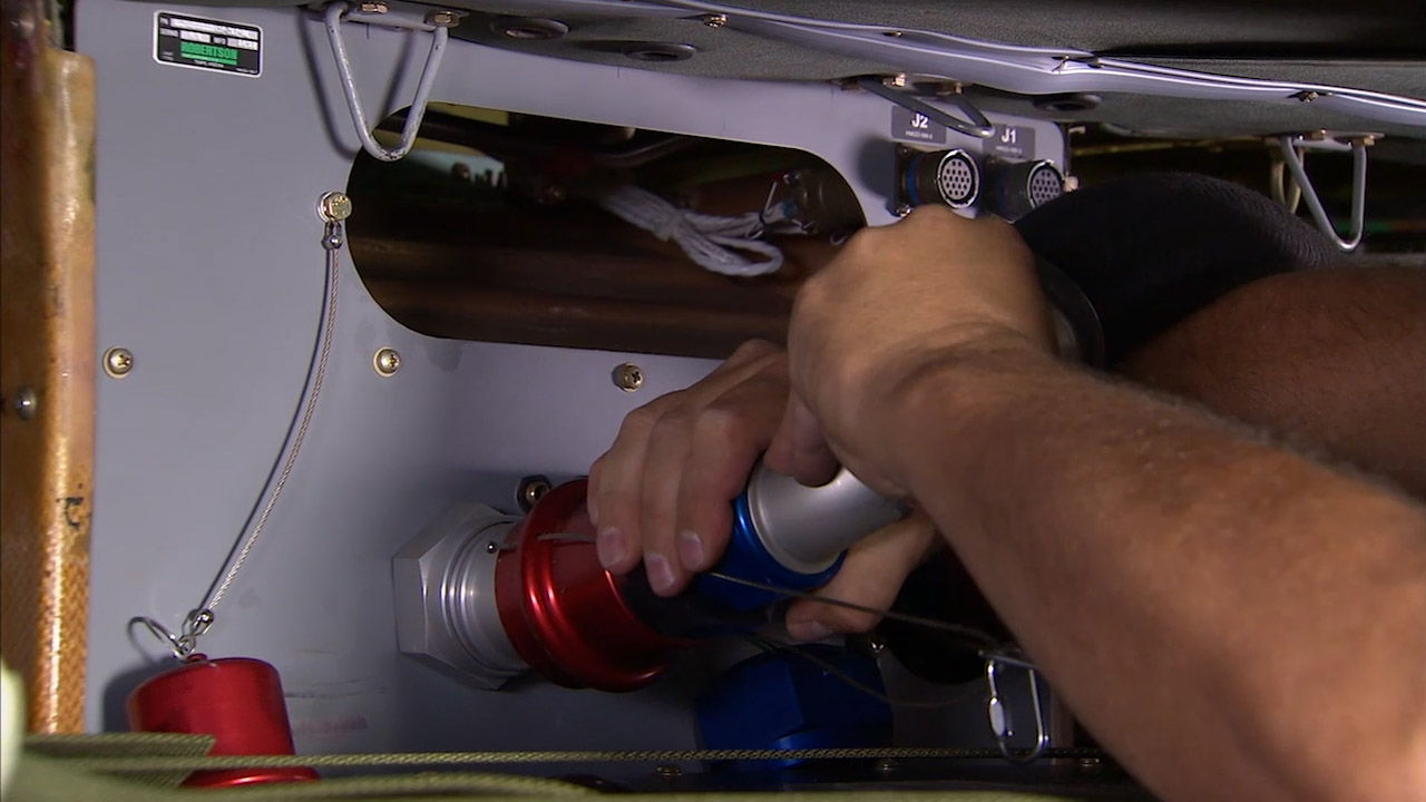 Installing Auxiliary Fuel Tank On Black Hawk Helicopter